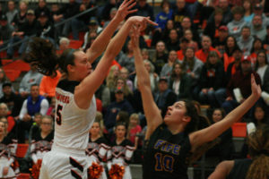 Washougal High School junior Beyonce Bea drains a three point shot during a regional playoff game against Fife, Saturday, Feb. 24, in Battle Ground. WHS won 55-38. Bea, a 4.0 GPA student, is the team's rock, according to WHS coach Brittney Knotts. 