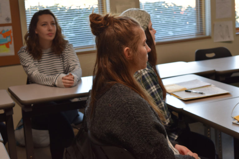 Hayes Freedom High School students from left to right, Darian Holmes, junior; Emma Carroll, sophomore; and Katie McNeil, sophomore, take one minute to do nothing but breathe at the start of their class led by teacher Monica Winkley.