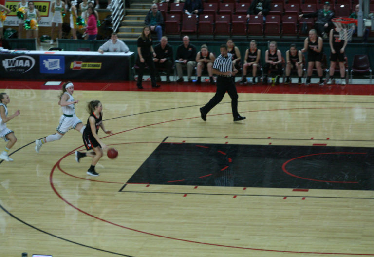 Mckinley Stotts outruns her opponents for an easy layup at the state tournament in Yakima.