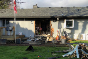 Camas-Washougal firefighters rescued a man and his two dogs from this home on Feb. 14, after a small kitchen fire spread, causing smoke to fill the residence. The firefighters union later filed a complaint with the Washington State Department of Labor and Industries, alleging that low staffing numbers at the fire department lead to unsafe working conditions and make it hard for firefighters to put out fires and save people trapped inside burning buildings. (Photo courtesy of Camas-Washougal Fire Department)