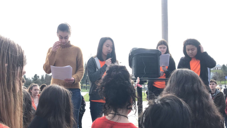 Camas High School students Catherine Garcia, Monica Chang, Sarah Wells-Moran and Abigail Jiang read the names and biographies of the 17 victims of a Feb. 14 mass school shooting in Parkland, Florida. These students and Tanner O&#039;Brien (not pictured) organized the walkout at Camas High in conjunction with the National School Walkout on March 14.