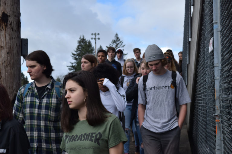 Washougal High School students exit Fishback Stadium on March 14. The students participated in a 17-minute walkout to honor the victims of the Parkland school shooting.