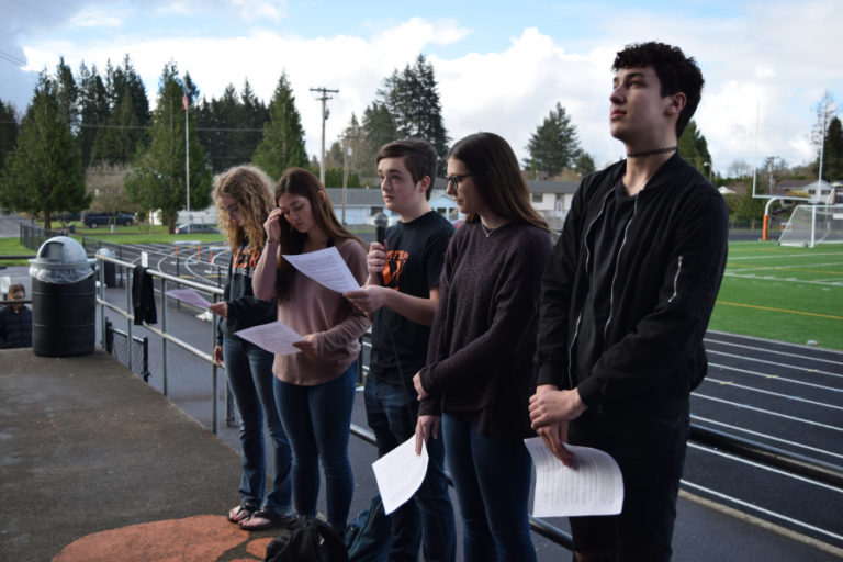 Washougal High School students, from left, Kate Northcut, Keana Macrae-Smith, Dylan Van Horn, Olivia Kelly and Jalen Watts read the names and biographies of the Parkland school shooting victims. The students worked with administrators to organize the March 14 event.