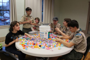 Volunteers from the Washington State School for the Blind and the local Boy Scout Troop 562 help fill plastic eggs with candy on March 26 at the Camas Community Center. Pictured here, from left to right are: Garrett Hawk, 14; Miles O'Bryant, 15; Cody West, 15; Blake Wegener, 17; Adam Anderson, 16; and Ken Koceja, 14. 