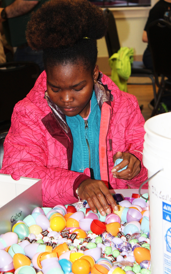 Tasha Jackson, 16, a student at the Washington State School for the Blind in Vancouver, fills plastic eggs with candy on March 26 at the Camas Community Center in preparation for the city of Camas&#039; annual Easter Day Egg Hunt, which starts at 1:30 p.m., Sunday, April 1, at Crown Park.