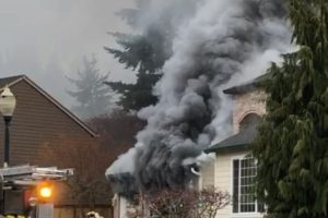 A fire caused extensive damage to an attached garage at a home in the 4500 block of Northwest Dahlia Drive in Camas this morning, displacing two families, but caused no injuries or fire damage to the attached home. (Photo courtesy of Camas-Washougal Fire Department)
