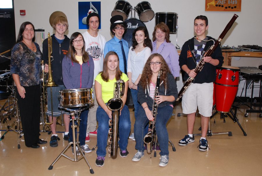 (Post-Record file photo)
Washougal choir teacher Jen Mahorney (second from right, back row) is pictured here in 2012 with several Washougal High School band and choir students who had been accepted into the annual National Association for Music Educator's All-Northwest/All-State honor groups. Students and staff in Washougal schools are mourning Mahorney this week. The choir teacher was found dead by the Skamania County Sheriff's Office during a welfare check on Tuesday, March 20.
Pictured here are (back row, left to right): WHS band teacher Kelly Ritter, Riley Miller, Austin Smith-Brown, Eloysius Leele, Zoe West, Mahorney and Nick Stevens. Front row, left to right: Crystal Saltmarsh, Sydney Niemi and Allix Fisher.