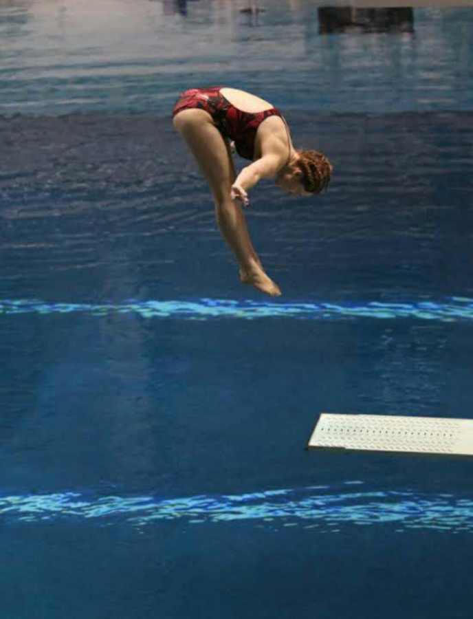Camas diver Lyn McGee holds a pike position during a recent practice dive at the Tualatin Hills Aquatics Center in Beaverton, Ore.