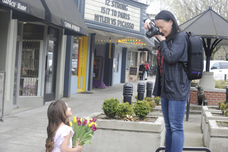 Tonya Wright, owner of Nest &amp; Love Photography, in Camas, takes photos of Priscilla Fiscu, 5, March 30, in downtown Camas. Wright also photographs high school seniors, families, weddings and other events.