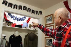 Camas-Washougal Historical Society President Jim Cobb points out a newly expanded military history display at the Two Rivers Heritage Museum in Washougal. 