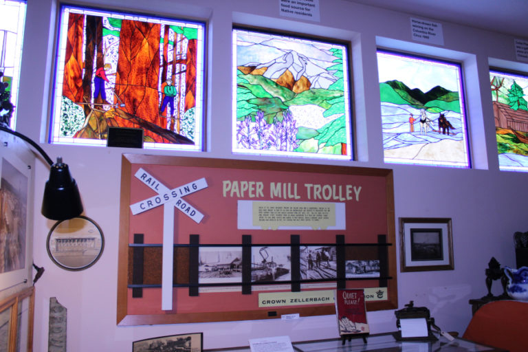 Stained glass scenes from Camas-Washougal, created by artist Teri Neville and funded by the Camas-Washougal Historical Society Memorial Funds, hang inside the Two Rivers Heritage Museum in Washougal.