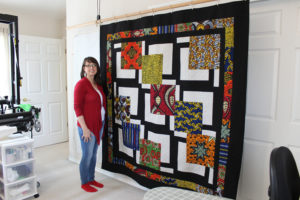 DeAnn Perrigo, a Camas quilter, and owner of Quiltthyme Studio, a long-arm quilting business, stands next to her "Out of Africa" quilt, which she plans to enter in this weekend's Clark County Quilters' 43rd annual Quilt Show at the Clark County Event Center. 