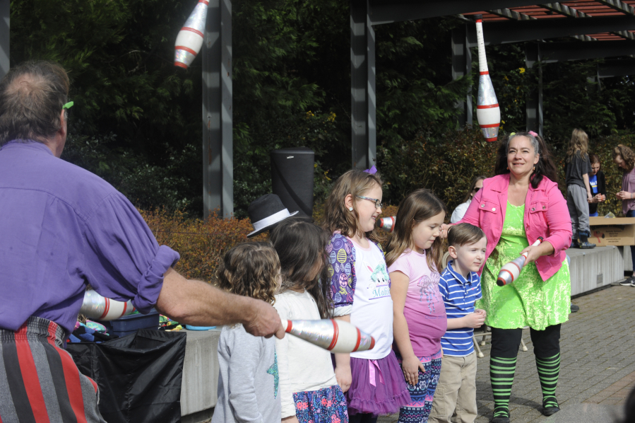 LEFT: Jugglers Charlie and Zephyr Brown entertain children at the Washougal "EGGstravaganza" on March 28.