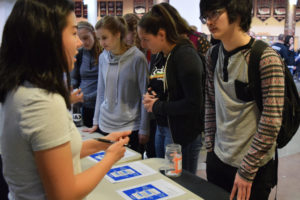 Camas High junior Abigail Jiang talks to students about Unity Week during lunch on Friday, March 30. Jiang helped organize the Unity Week, which featured a different theme every day, including Global Action, LGBTQ and Visibility, Gender Equality, Religious Awareness and Unity Day.