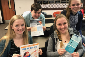 Washougal High School students, left to right, Bridgette McCarthy, Jared Johnson, Katie Boon and Lauren Bennett hold fliers for the Washougal Drug Take-Back, an event the students helped organize through Unite! Washougal Community Coalition. The take-back event will be held from 10 a.m. to 2 p.m., Saturday, April 28, at Silver Star Search and Rescue, 1220 "A" St., Washougal. (Tori Benavente/Post-Record)