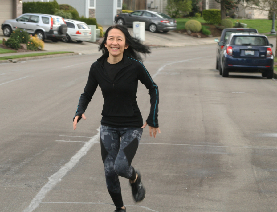 Camas resident Satomi Sano-Abrahamsen trains for the Boston Marathon in her Camas neighborhood in early April. (Wayne Havrelly/Post-Record)