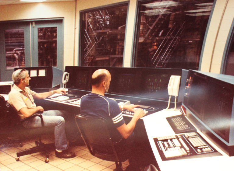 Camas paper mill workers operate 1980s-era computers at the mill during the start up of the &quot;Roaring 20&quot; office paper machine in 1984. The No.