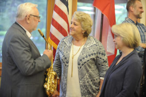 Former Polish Chief Justice Jerzy Stępień talks with Washougal Mayor Molly Coston (center) April 27, after a sister city reception at Lacamas Lake Lodge, in Camas. Julie Scott (right) and her husband, Washougal City Administrator David Scott (not pictured) are hosting two of the Polish delegates during their weeklong stay.