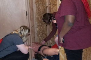 Camas High School forensics students investigate a fake body found inside a closet at the Portland Police Bureau's training facility, during a field trip on April 26. (Contributed photos by Alixandra Coker)