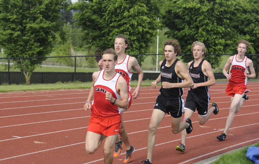 Papermakers distance runner David Connell leads the pack in the 1,600-meter race at Union High School on Friday, May 4. 