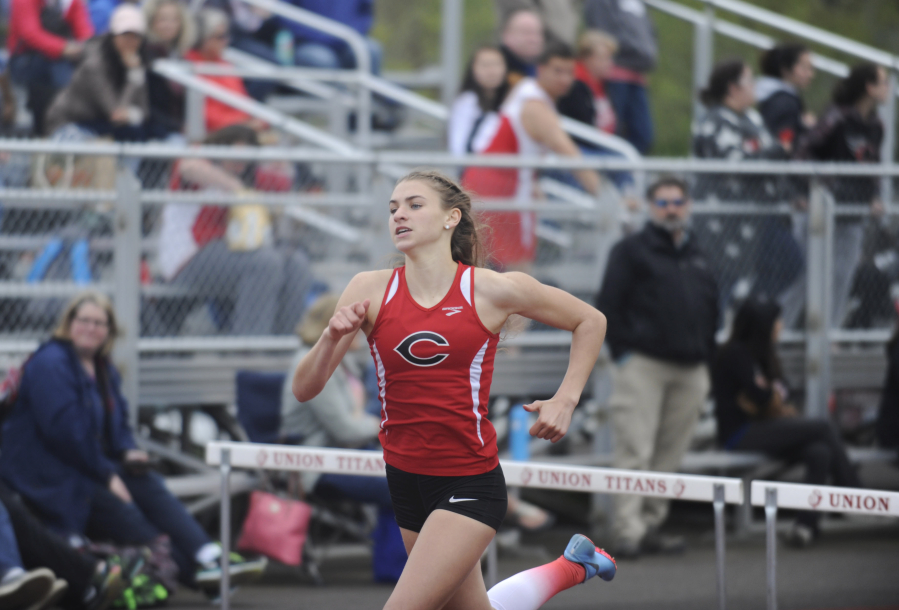 Camas High School freshman Lucy George pulls away to win the 300 meters hurdle event at Union High School on Friday, May 4. 