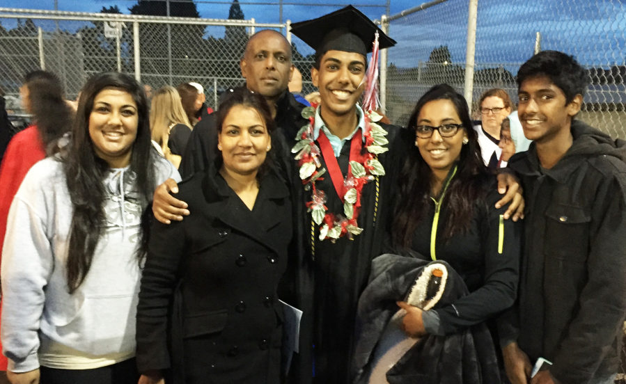 The Nair family, including (from left to right) Darshana, Parmila, Vimal, Vishal, Neha and Krishnan, pose for photos at Vishal Nair's 2016 Camas High School graduation. Parents Parmila and Vimal Nair moved to Camas from Fiji in 1992, in part to give their children more opportunities to get an education. In the fall, all four of the Nair children will be enrolled in college. (Contributed photo courtesy of Krishnan Nair)