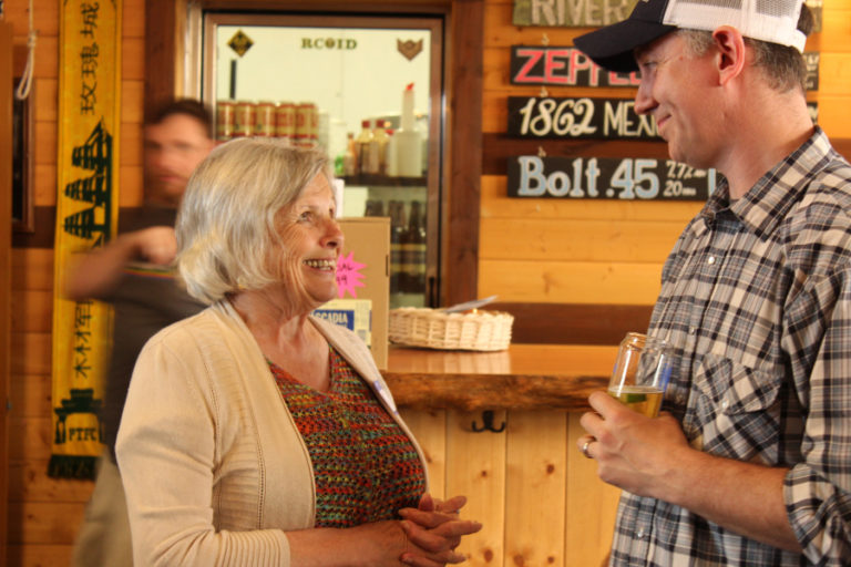 Washougal City Councilwoman and Mayor Pro Tem Joyce Lindsay (left) talks to 54?40&#039; Brewing Company owner Bolt Minister at a May 9 fundraiser for congressional candidate Carolyn Long, a Democrat vying for Republican Rep.