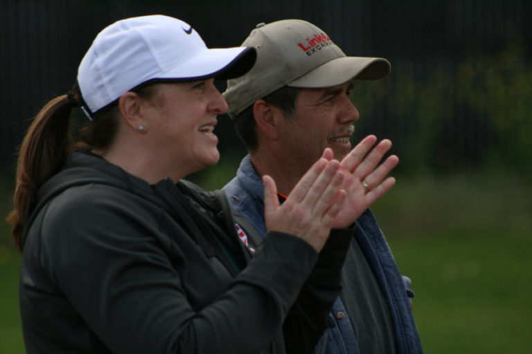 Kennedy Fergusons’ parents Deeann and David root on their daughter at the Union High School softball field with just two outs to go for her first perfect game.