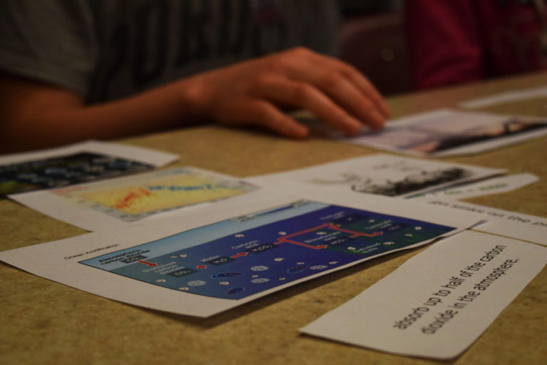 The Youth Research Scholars club, hosted by Camas High School students for Liberty Middle School students, discuss various science, technology, engineering and math concepts, such as the effect that the paper mill may have on the pH in water or how to solve large problems by breaking them down.