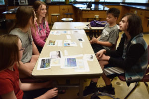 From left to right, Liberty Middle School student Claire McBride, Camas High School sophomore Emma McBride, Camas High sophomore Hannah Tangen, Liberty Middle School student Jackson Barnes, and fellow Liberty student Hayden Newell meet at an afterschool session of the Youth Research Scholars on May 17.