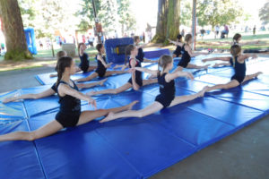 Gymnasts from Vancouver Elite Gymnastics Academy, of Camas, demonstrate their skills during the Camtown Youth Festival, in Crown Park, on Saturday, June 2. The event also featured Camas Soo Bahk Do karate demonstrations and performances by student musicians. 