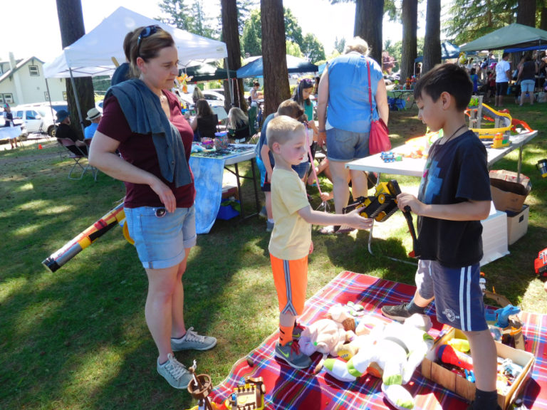 Young entrepreneurs sell toys, games and homemade arts and crafts, at the Camtown Youth Festival children&#039;s flea market, on Saturday, June 2.