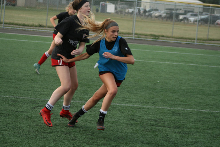 Alexis &quot;Lulu&quot; Sadler from Camas intensely competes against a teammate during practice at Harmony Sports Complex in Vancouver.