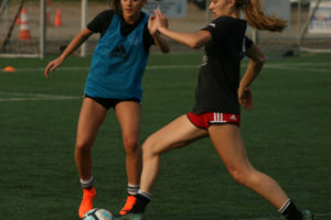 Avery Smith (left) and Liz Parker (right) from Camas High School intensely train in preparation for the regional youth soccer tournament in Honolulu, Hawaii.