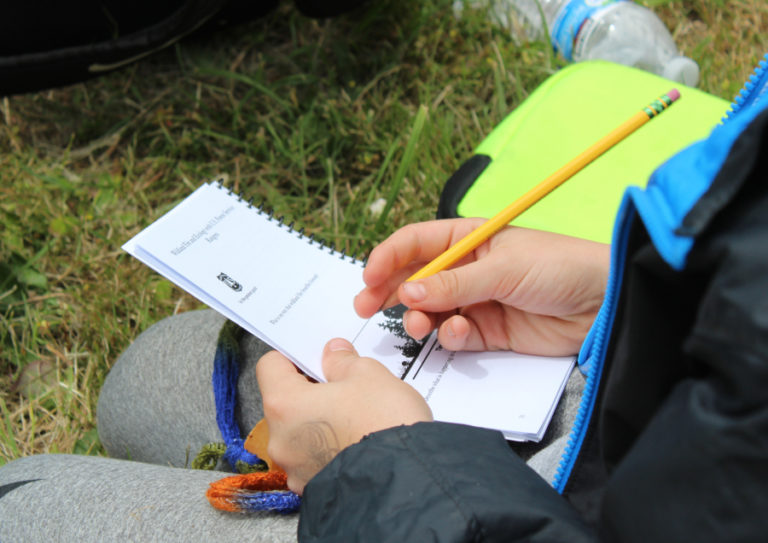 Brayden Kassel, 11, a sixth grade student at Canyon Creek Middle School in Washougal writes in his Outdoor School 2018 Explore the Gorge field guide on June 14.