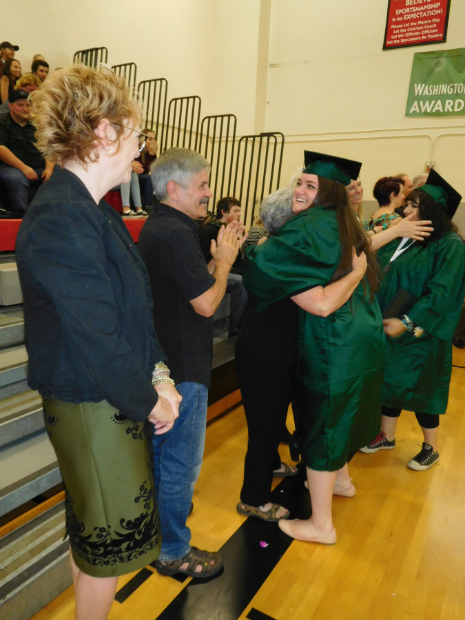 Hayes Freedom faculty and staff congratulate graduates after they receive their diplomas Saturday, June 16.