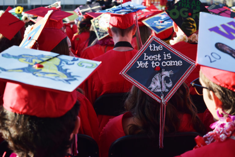 Camas High School graduates decorated their graduation caps with inspirational quotes and future college logos.