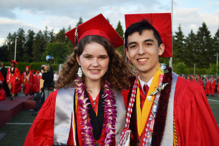 Camas High class of 2018 valedictorians Amanda Sturges (left) and Noah Thompson (right) pose after receiving their diplomas on June 15.