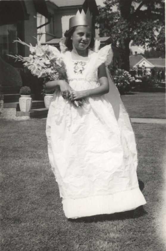 A 10-year-old Maxine (Miller) Ambrose poses in a paper dress crafted by her mother, Fae Miller, for her role as the 1940 Junior Queen of the Paper Festival in Camas.