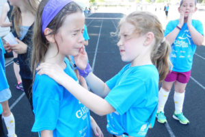 Helen Baller Elementary students take a break from training to run a 5K, to apply sunblock at Doc Harris Stadium in Camas. The students in third through fifth grades participate in the Girls on the Run International program, which seeks to inspire girls to be joyful, healthy and confident. 