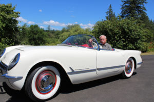 Steve Chaney sits in his meticulously restored 1954 Chevrolet Corvette outside his home near the Camas-Vancouver border on June 28. 