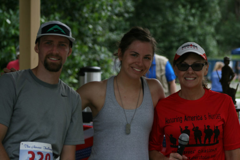 10K winners Casey Kemp, Kristin Lesseig and race organizer Sondra Grable celebrate a successful Heroes&#039; Challenge, on July 4.