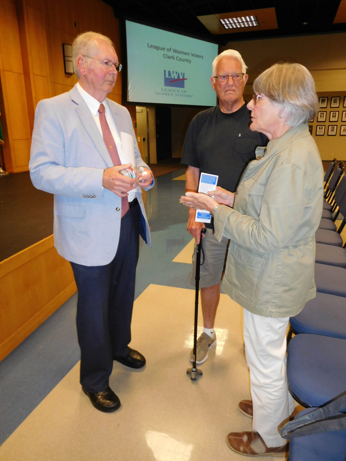 Earl Bowerman (left), a Republican candidate for the 3rd Congressional District, listens to people who attended a  League of Women Voters of Clark County forum, July 12, at Clark College, in Vancouver.