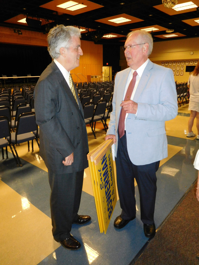 Democrat David McDevitt (left) and Republican Earl Bowerman are among the last people to leave after a forum July 12 at Clark College in Vancouver.