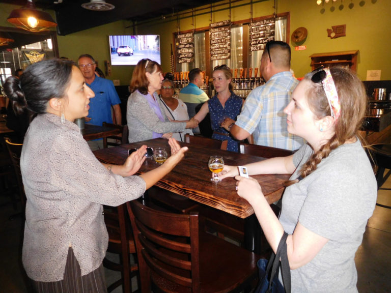 Participants in the Columbia River Economic Development Council&#039;s Main Street Day sample beer at Grains of Wrath Brewing, in downtown Camas, July 13.