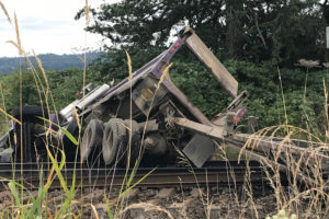 (Contributed photo, provided courtesy of Sean Streeter)
A double dump truck crashed onto railroad tracks at Southeast 356th Ave. and Southeast Evergreen Highway, outside the city limits of Washougal, Thursday afternoon. The driver sustained minor injuries, and there was significant railroad track damage. Ten trains were delayed, according to Gus Melonas, with BNSF Railway.