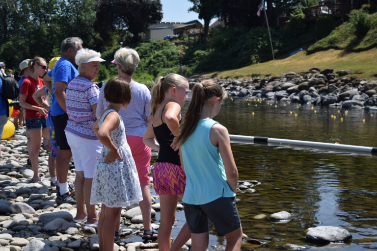Members of the Camas-Washougal community gathered near the finish line of the Ducky Derby to watch the 5,000 rubber ducks float till the end. The Camas-Washougal Rotary Club has hosted the fundraiser for the last 24 years to raise funds for Rotary projects, including scholarships for local graduates and back to school supplies. 