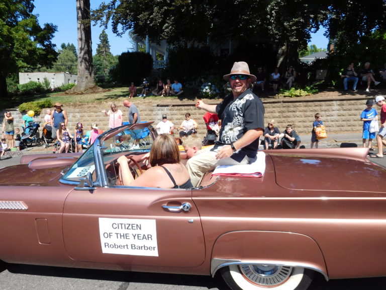 Robert Barber, the Camas-Washougal Chamber of Commerce 2018 “Citizen of the Year,” rides in the Camas Days Grand Parade, Saturday, July 28. Barber, the pastor of St. Matthew Lutheran Church in Washougal, spearheaded efforts to coordinate volunteers for a temporary, severe weather shelter in Washougal.  

