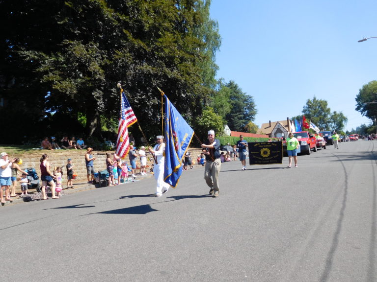 The Veterans of Foreign Wars Post 4278 Color Guard leads the Camas Days Grand Parade Saturday, July 28, in downtown Camas.