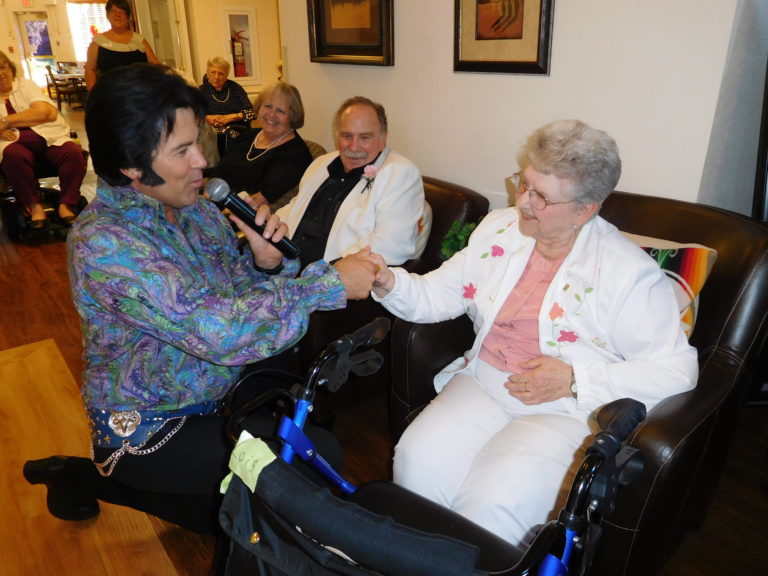 Mark Stevenz, an Elvis tribute artist and former Washougal resident, visits with Senior Prom attendees, Thursday, July 26, at Columbia Ridge Senior Living, in Washougal.